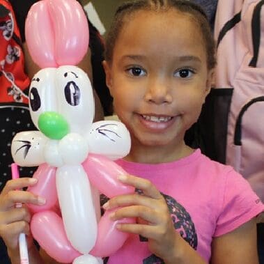 girl holding balloon